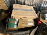 a pile of boxes sitting on top of a pile of luggage