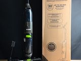 a vacuum that is sitting on a table next to a box