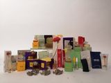 a lot of different types of perfumes on the table