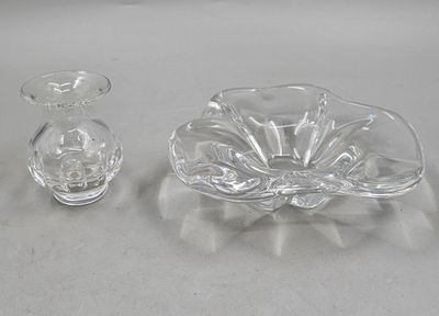 a small glass bowl and a small glass vase on a table