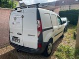 a white van that is parked in front of a house