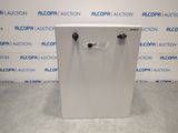 a white box with a black latch on it sitting in front of a blue and white wall