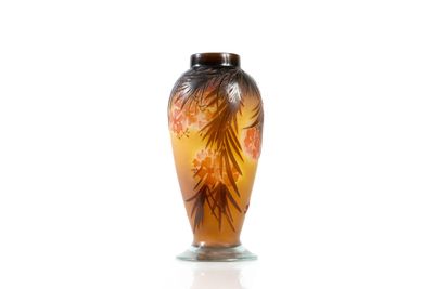 a glass vase with a design on it on a white surface