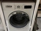 a washer and a dryer in a small room