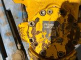 a yellow fire hydrant that has a sticker on it