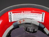 a close up of a helmet with a danger label on it
