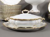 many plates and bowls that are sitting on a table