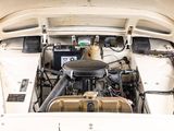 a small engine in the back of a white car