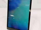 a tablet with a screen on it sitting on a table