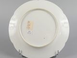 underside view of a plate with a design on the rim