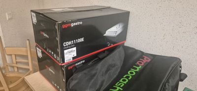 a black bag sitting on top of a stack of boxes