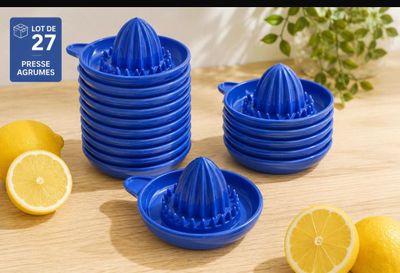 lemons and a juicer on a table with lemons
