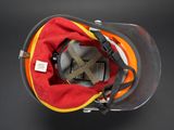 a fireman ' s helmet with a red and yellow cover on it