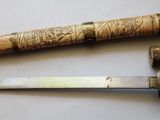 two knives that are laying next to each other on a table