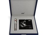 a box with a pen and a card in it on a white surface