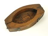 an old wooden box with a carving of a dragon on it