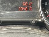 a digital clock on the dashboard of a car