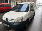a white van that is parked on the side of the street