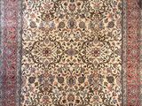 an antique persian rug with a floral design on a white background