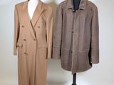 two coats on a mannequin stand on a white background
