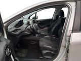 the interior of a car with the door open and the driver ' s seat down
