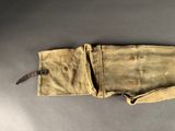 an old pair of gloves with a knife in it