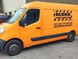 an orange van that is parked in a parking lot