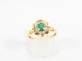 an emerald and diamond ring