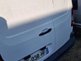 a white van parked in a parking lot with other cars