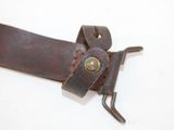 a brown leather belt with a metal buckle on it