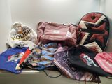 a lot of clothes and a bag on a shelf