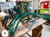 a table that has a bunch of green chairs on it