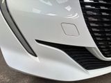 a close up of a car ' s front grill and badge