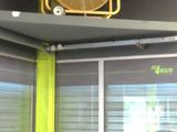 a fan that is hanging from the ceiling in a gym