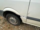 a white van parked on the side of the road