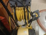 a yellow and black air compressor sitting on a counter