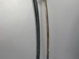 two old swords are displayed on a white surface