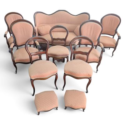 an image of a group of chairs and ottomans in a circle