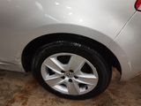 a close up of a car tire on a dirty floor