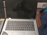 two laptops that are sitting on a wooden table