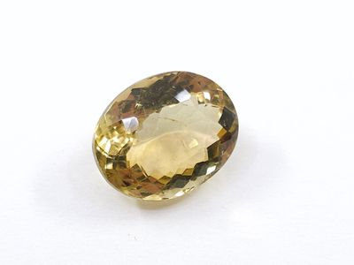 citrine faceted oval cut gemstone with yellow topaz