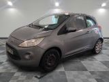 a picture of a grey car parked in a garage