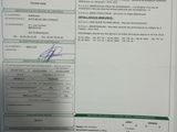 a document with a picture of a person holding a cell phone