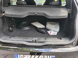 the back of a car with the trunk open and a lot of electronics in the trunk