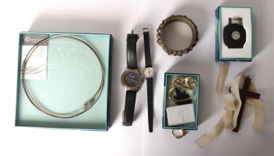 a box with a watch, a bracelet, a watch, a watch, a watch, a bracelet, a watch, a watch, a watch,