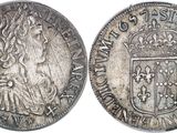 a close up of a coin with a crown on it