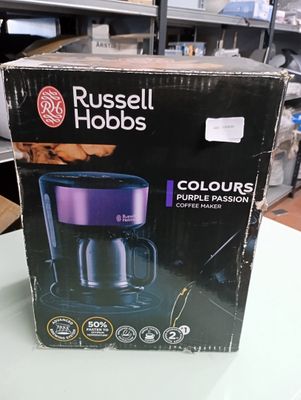 packaging of russell hobbs coffee maker on a table in a kitchen