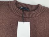 a brown sweater with a tag hanging on it