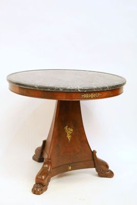 an image of a table with a marble top and wooden legs