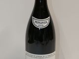 a bottle of wine that is sitting on a table